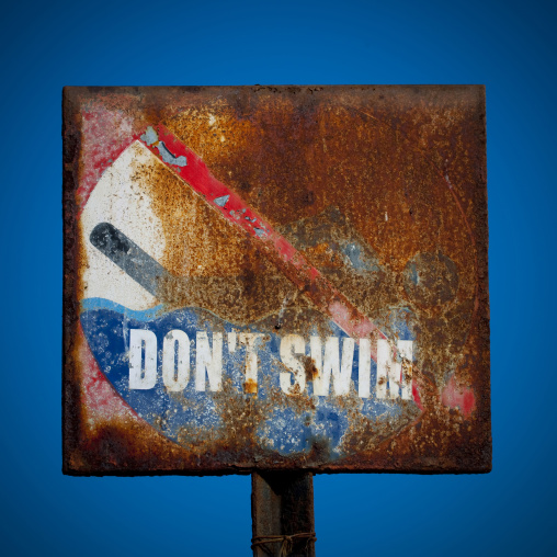 Rusty Do Not Swim Sign In Pondicherry, India