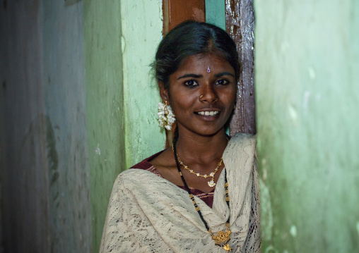 Smiling Midadult Woman With Flower Earring On The Doorstep, Kumbakonam, India