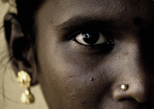 Close Up Of The Dark Eyes Of A Tamil Nadu Woman With Nose Piercing And Earrings, Kumbakonam, India