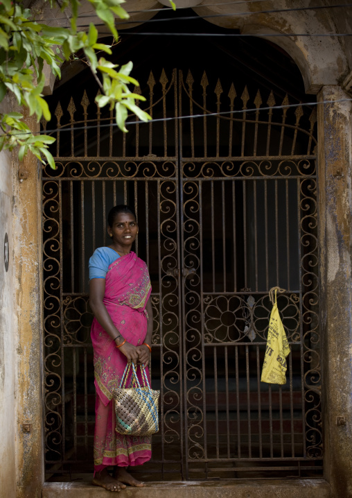 Woman In Sari Holding A Handbag And Smiling In Front Of Her House In Chettinad, India
