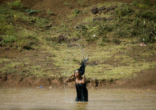 Woman Washing Her Hair In A Lake, Kanadukathan Chettinad, India