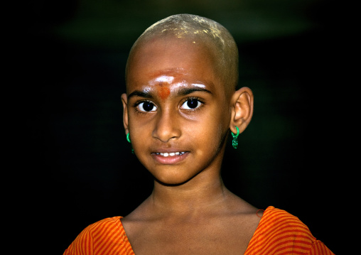 Young Girl With Shaved Head Covered With Sandalwood Paste In Sri Ranganathaswamy Temple, Trichy, India