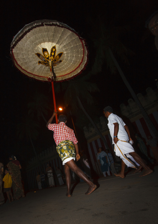 Man Holding A Giant And Decorated Umbrella During A Procession To The Sri Ranganathaswamy Temple, Trichy, India