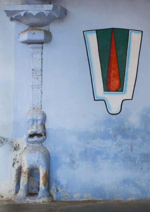 Vaishnava Tilak Painted On A Blue Wall Next A Carved Bas Relief In The Sri Ranganathaswamy Temple, Trichy, India