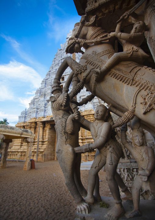 Intricately Carved Pillars Depicting A Horse Rearing During A Fight In Front Of A White Gopuram At The Sri Ranganathaswamy Temple, Trichy, India