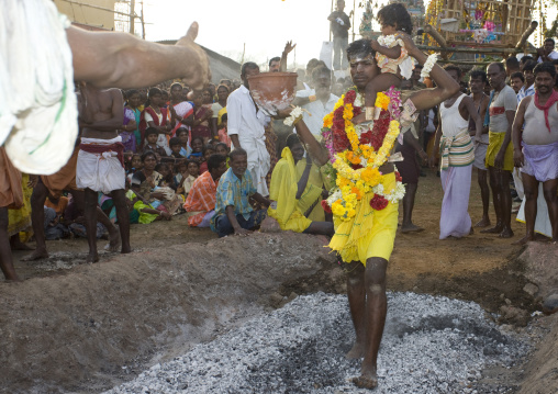 Man With Offerings Carrying A Baby On His Shoulder Performing A Fire Walking Ritual, Madurai, South India