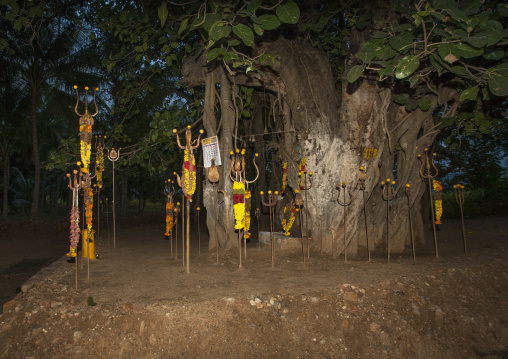 Old Altar Of Stones Surrounded By Trishuls, The Trident Of Shiva And Vels, Murugan's Spear, Covered With Offerings, Madurai, India