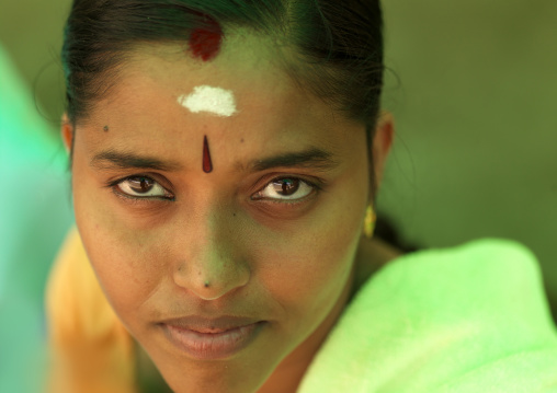 Portrait Of A Young Indian Woman With Traditional Painting On Her Forehead, Madurai, India