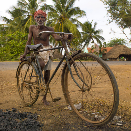 Old Man Wearing Turban Posing With His Rusty Bike By The Wayside, Pondicherry, India
