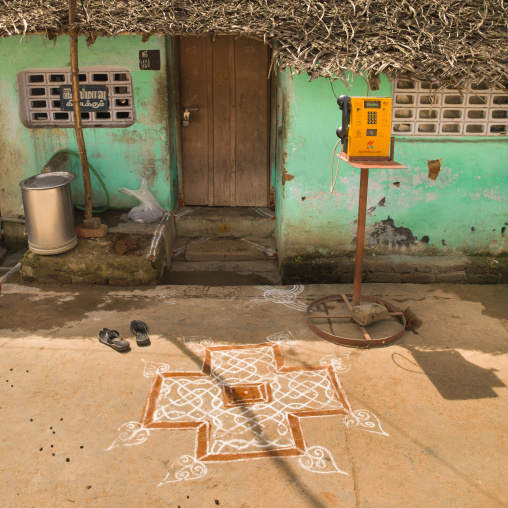 Kolam Drawned In Front Of House With Green Decrepit Wall And A Public Phone, Kumbakonam, India