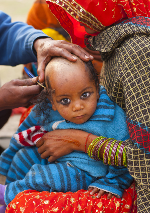 Kid Having His Hair Shaved, Maha Kumbh Mela, Allahabad, India