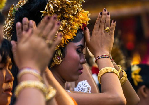 A Teenager Girl In Traditional  Costume Praying Before A Tooth Filing Ceremony