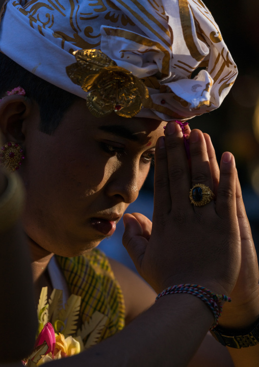 A Teenager Boy In Traditional  Costume Praying Before A Tooth Filing Ceremony
