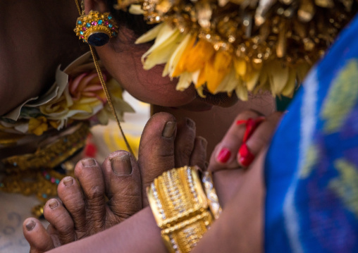 A Teenager Girl In Traditional  Costume Paying Respect To Her Mother Before A Tooth Filing Ceremony