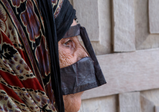 a bandari woman wearing a traditional mask called the burqa, Qeshm Island, Salakh, Iran