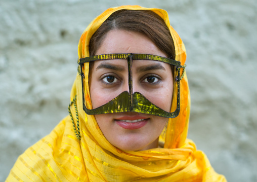 a smiling bandari woman wearing a traditional mask called the burqa with a moustache shape, Qeshm Island, Salakh, Iran
