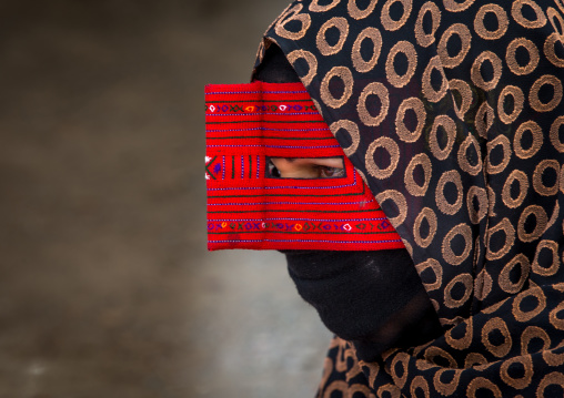 a bandari woman wearing a traditional mask called the burqa at panjshambe bazar thursday market, Hormozgan, Minab, Iran
