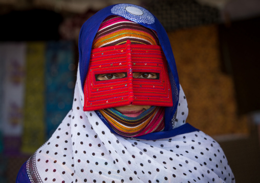 a bandari woman wearing a traditional mask called the burqa at panjshambe bazar thursday market, Hormozgan, Minab, Iran