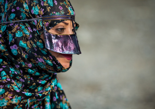 a bandari woman wearing a traditional mask called the burqa at panjshambe bazar thursday market, Hormozgan, Minab, Iran