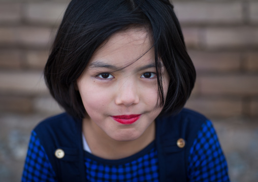afghan refugee girl with lipstick, Central County, Kerman, Iran