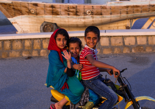 children riding a motorbike, Qeshm Island, Laft, Iran