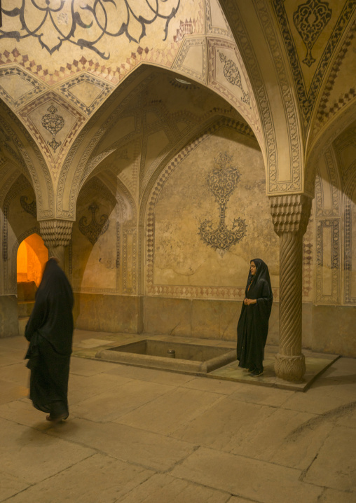 Veiled woman in the karim khan fort bath, Fars province, Shiraz, Iran