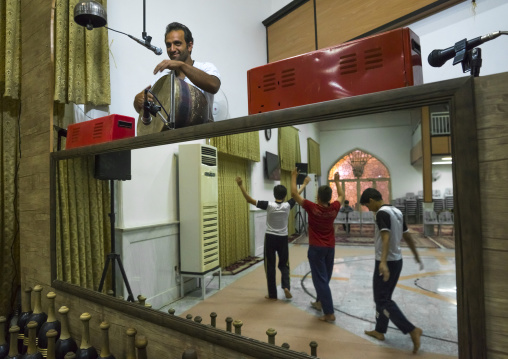 Musician playing during the traditional sport of zurkhaneh, Isfahan province, Kashan, Iran