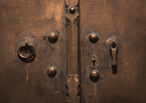 Old door with two doorknockers for men and women, Isfahan province, Kashan, Iran