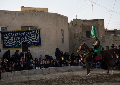 Man riding a horse during a traditional religious theatre called tazieh about Imam Hussein death in Kerbala, Isfahan Province, Isfahan, Iran
