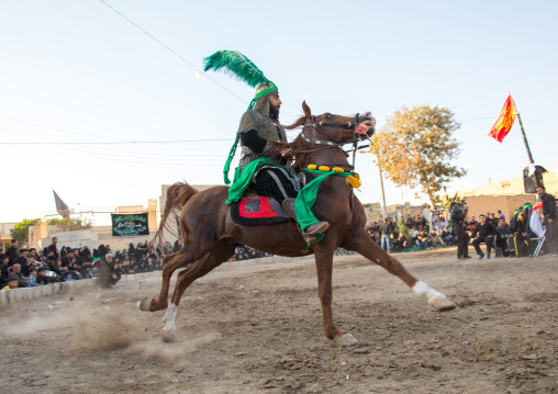 Man riding a horse during a traditional religious theatre called tazieh about Imam Hussein death in Kerbala, Isfahan Province, Isfahan, Iran