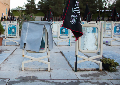 Tombs of women killed during the wars in the Rose garden of martyrs cemetery are covered by the families, Isfahan Province, Isfahan, Iran