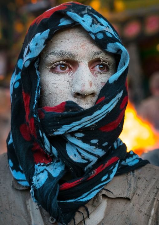 Iranian shiite muslim man after rubbing mud on his body during the Kharrah Mali ritual to mark the Ashura ceremony, Lorestan Province, Khorramabad, Iran