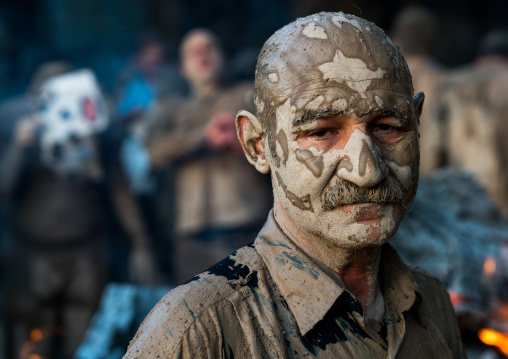 Iranian shiite muslim man after rubbing mud on his body during the Kharrah Mali ritual to mark the Ashura ceremony, Lorestan Province, Khorramabad, Iran