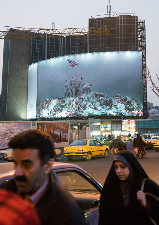 parody of raising the flag on iwo jima historic picture on valiasr square showing american marines on dead bodies, Central district, Tehran, Iran