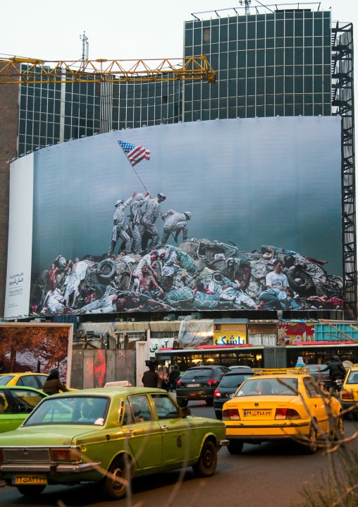 parody of raising the flag on iwo jima historic picture on valiasr square showing american marines on dead bodies, Central district, Tehran, Iran