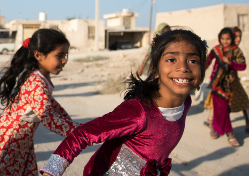 little girls having fun in the street, Qeshm Island, Salakh, Iran