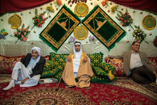 groom posing with his new traditional clothes during a wedding ceremony, Hormozgan, Bandar-e Kong, Iran
