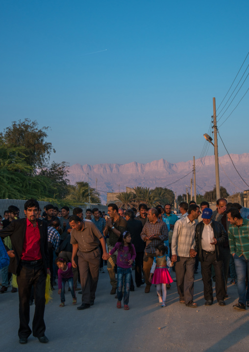 men going to the groom house for a wedding ceremony, Hormozgan, Kushkenar, Iran