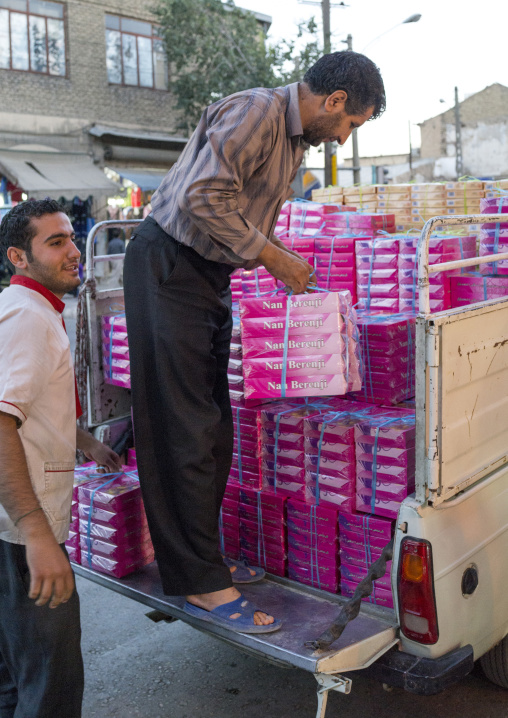 Men Chargiing Cakes Boxes In The Bazaar, Kermanshah, Iran