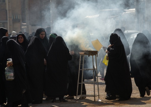 Shia Muslim Women Lighting Incense During Chehel Menbari Festival On Tasua Day For Ashura Celebration, Lorestan Province, Khorramabad, Iran