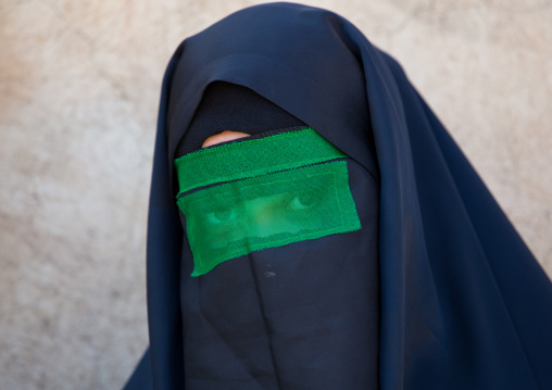 Iranian Shiite Muslim Woman Mourning Imam Hussein On The Day Of Tasua With Her Face Covered By A Green Veil, Lorestan Province, Khorramabad, Iran