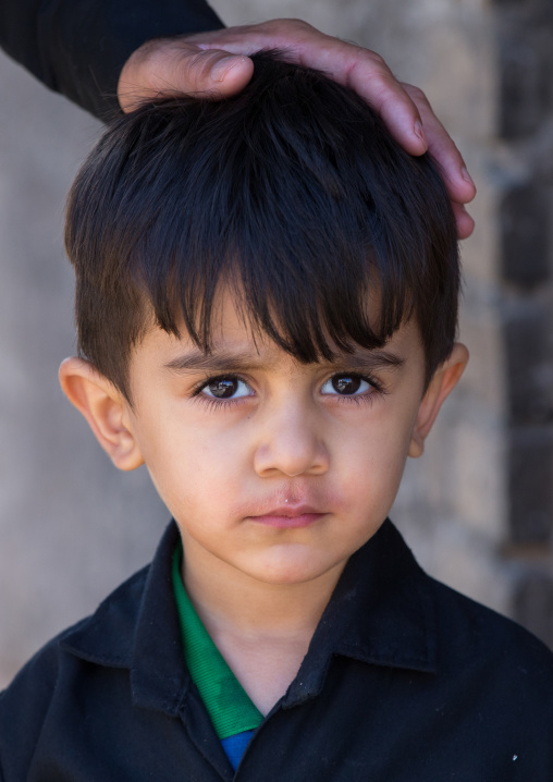 An Iranian Shiite Boy With His Father Hand On His Head During Tasua Celebrations One Day Before Ashura, Lorestan Province, Khorramabad, Iran