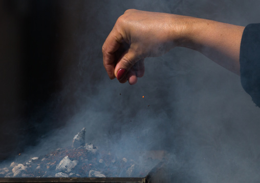 Shia Muslims Women Lighting Incense During Chehel Menbari Festival On Tasua Day For Ashura Celebration, Lorestan Province, Khorramabad, Iran