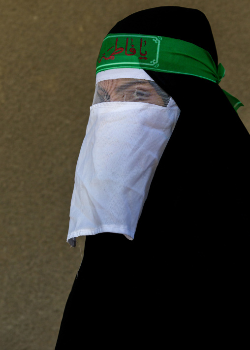 Iranian Shiite Muslim Woman Mourning Imam Hussein On The Day Of Tasua With Her Face Covered By A Veil, Lorestan Province, Khorramabad, Iran