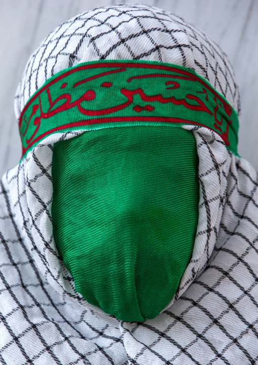Iranian Young Man With Green Veil Covering His Face During Chehel Menbari Festival On Tasua To Commemorate The Martyrdom Of Hussein, Lorestan Province, Khorramabad, Iran