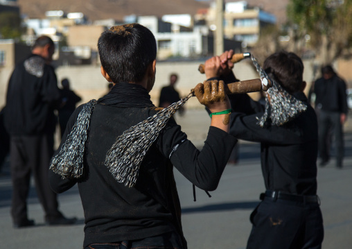 Iranian Shiite Boys Covered In Mud Are Beating Themselves With Iron Chains To Commemorate Ashura, The Day Of The Death Of Imam Hussein, Kurdistan Province, Bijar, Iran