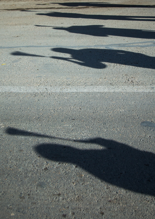 Shadows Of Iranian Shiite Men Who Are Beating Themselves With Iron Chains During Ashura, The Day Of The Death Of Imam Hussein, Kurdistan Province, Bijar, Iran