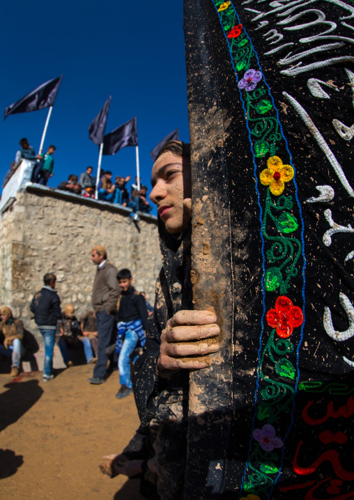 Iranian Shiite Muslim Girl Covered In Mud During Ashura, The Day Of The Death Of Imam Hussein, Kurdistan Province, Bijar, Iran
