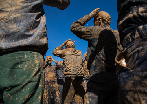 Iranian Shiite Muslim Men Covered In Mud, Chanting And Self-flagellating During Ashura, The Day Of The Death Of Imam Hussein, Kurdistan Province, Bijar, Iran