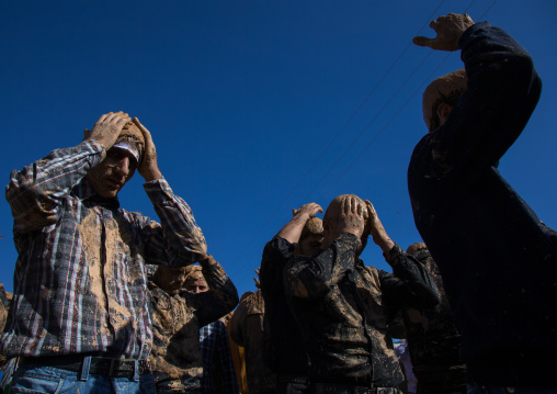 Iranian Shiite Muslim Men Covered In Mud, Chanting And Self-flagellating During Ashura, The Day Of The Death Of Imam Hussein, Kurdistan Province, Bijar, Iran
